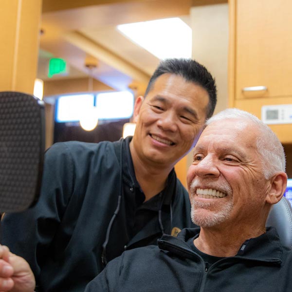 Dr. Siao with full mouth reconstruction patient, Walt