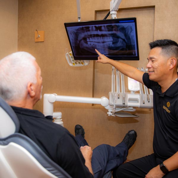 Dr. Siao consulting dental patient